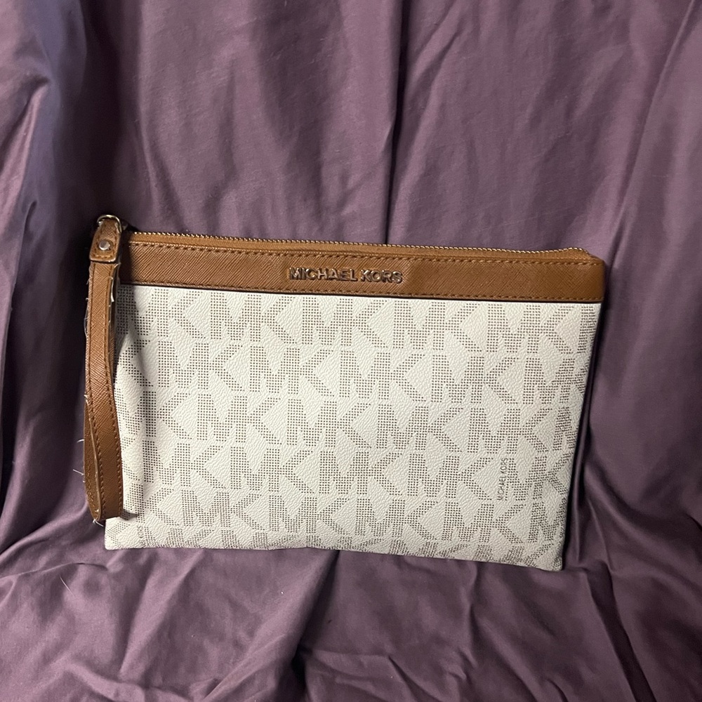 White and tan Michael Kors large wristlet
